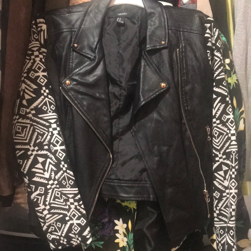 Faux leather jacket with Aztec print sleeves.